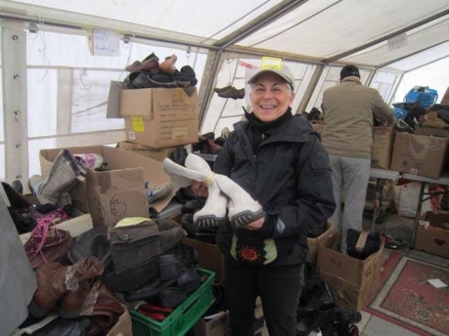 The author tending to her job in the shoe "store," a place where refugees came to replace their shoes after weeks on the road.