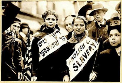 "ABOLISH CH[ILD] SLAVERY!!" in English and Yiddish ("Nider mit Kinder Schklawerii"), probably taken during May 1, 1909 labor parade in New York City. George Grantham Bain Collection (Library of Congress).