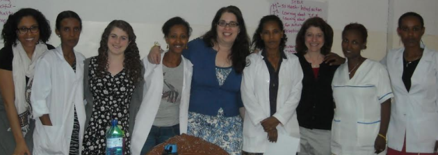 Photo of Dr. Gladstone (right in black shirt), Sarah (left in floral dress), the training team, and the nurses who were trained in Gondar.