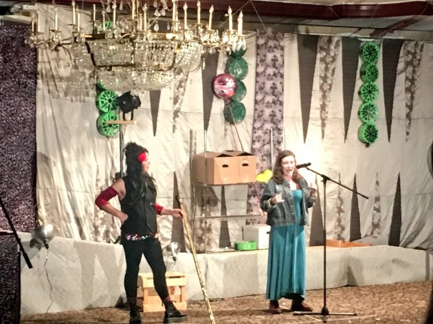 Rosa Lander (right) speaking at JFREJ's Purim Carnival and March.