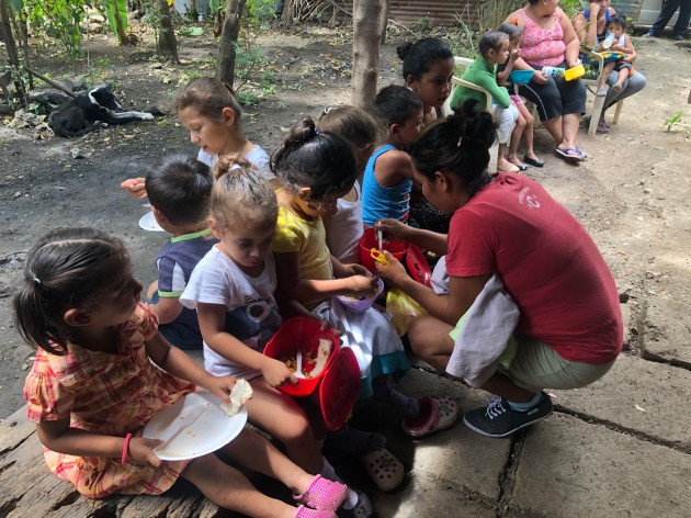 Members of the Women's Network feed children in Tipitapa, Nicaragua. The Women's Network is run by Nicaraguan women and is aiming to become self-sustaining—and not rely on international donations. 