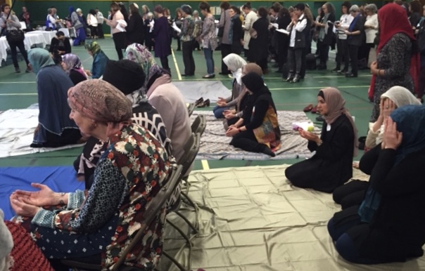 Side by side in prayer, Muslim women (front), Jewish women (back) at Sisterhood of Salaam Shalom national conference. Photo: Amy Stone